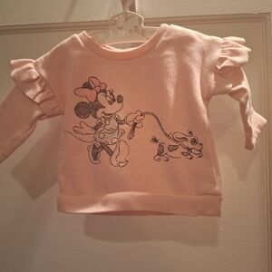 Disney Minnie Mouse lite pink sweatshirt has a cute ruffle on sleeve